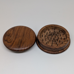 Crafted from rich, natural rosewood, this 3″ round grinder offers a smooth, classic feel with reliable performance. The precision-mounted teeth make grinding herbs and spices easy and consistent. Its warm wood finish and durable build combine timeless style with everyday functionality — perfect for collectors or daily use alike.